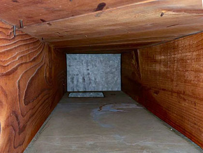 A picture of a very clean wooden air duct.